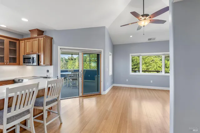 an open kitchen with a table and chairs