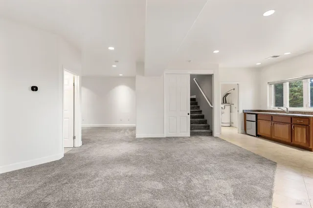 a view of an empty room with stairs