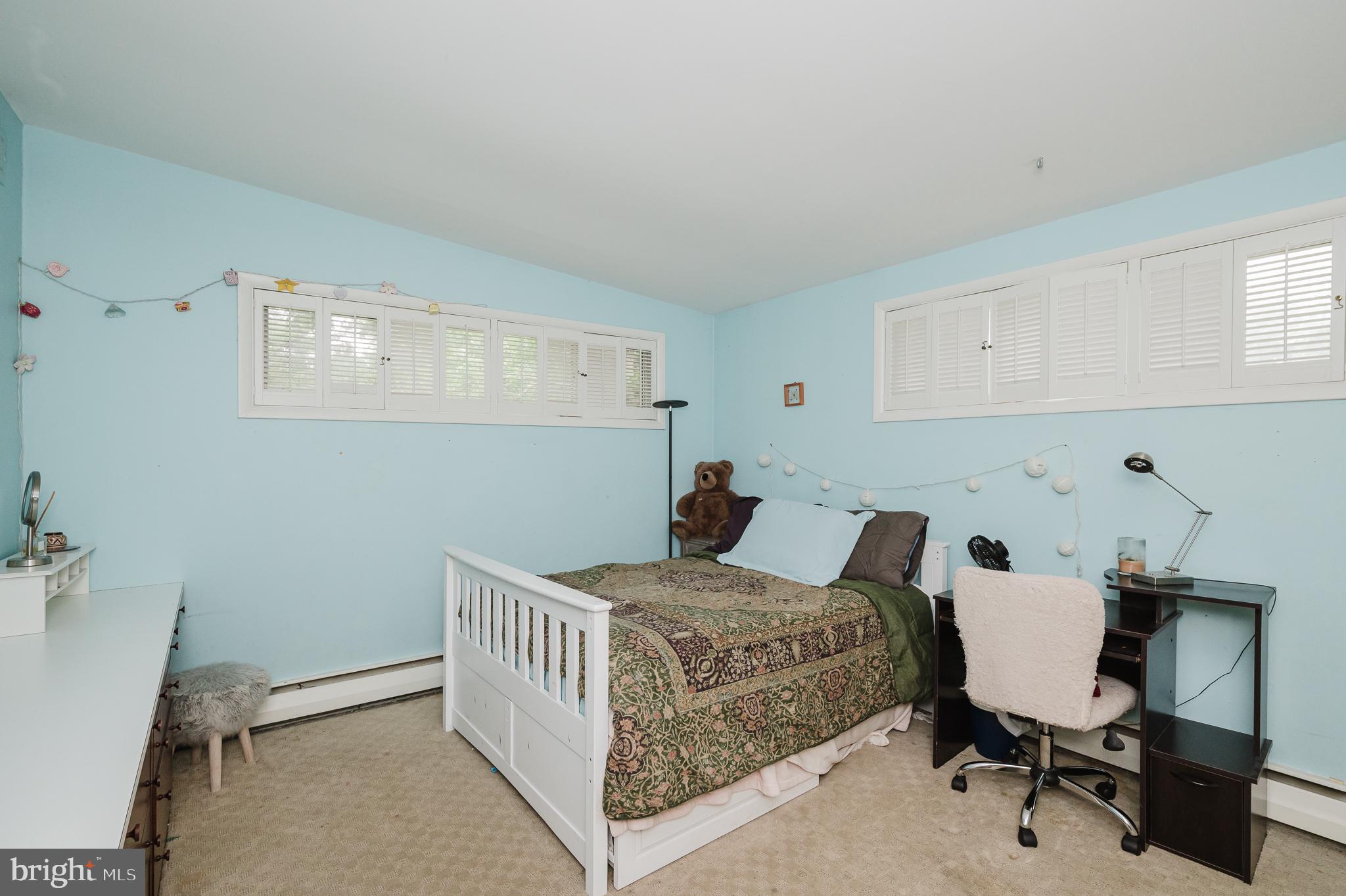 3228 Midfield Road Pikesville, MD 21208 - Photo 24 of 42 Serene blue-hued bedroom retreat.