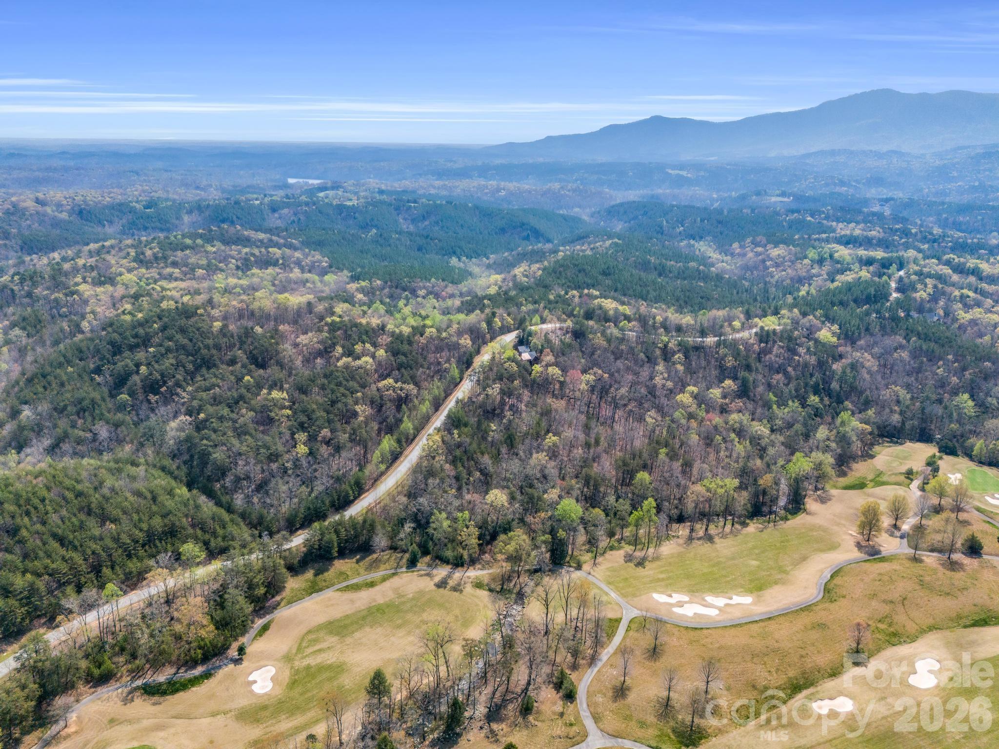 0 Deep Gap Farm Road East Mill Spring, NC 28756 - Photo 17 of 39 a view of a city with mountains in the background