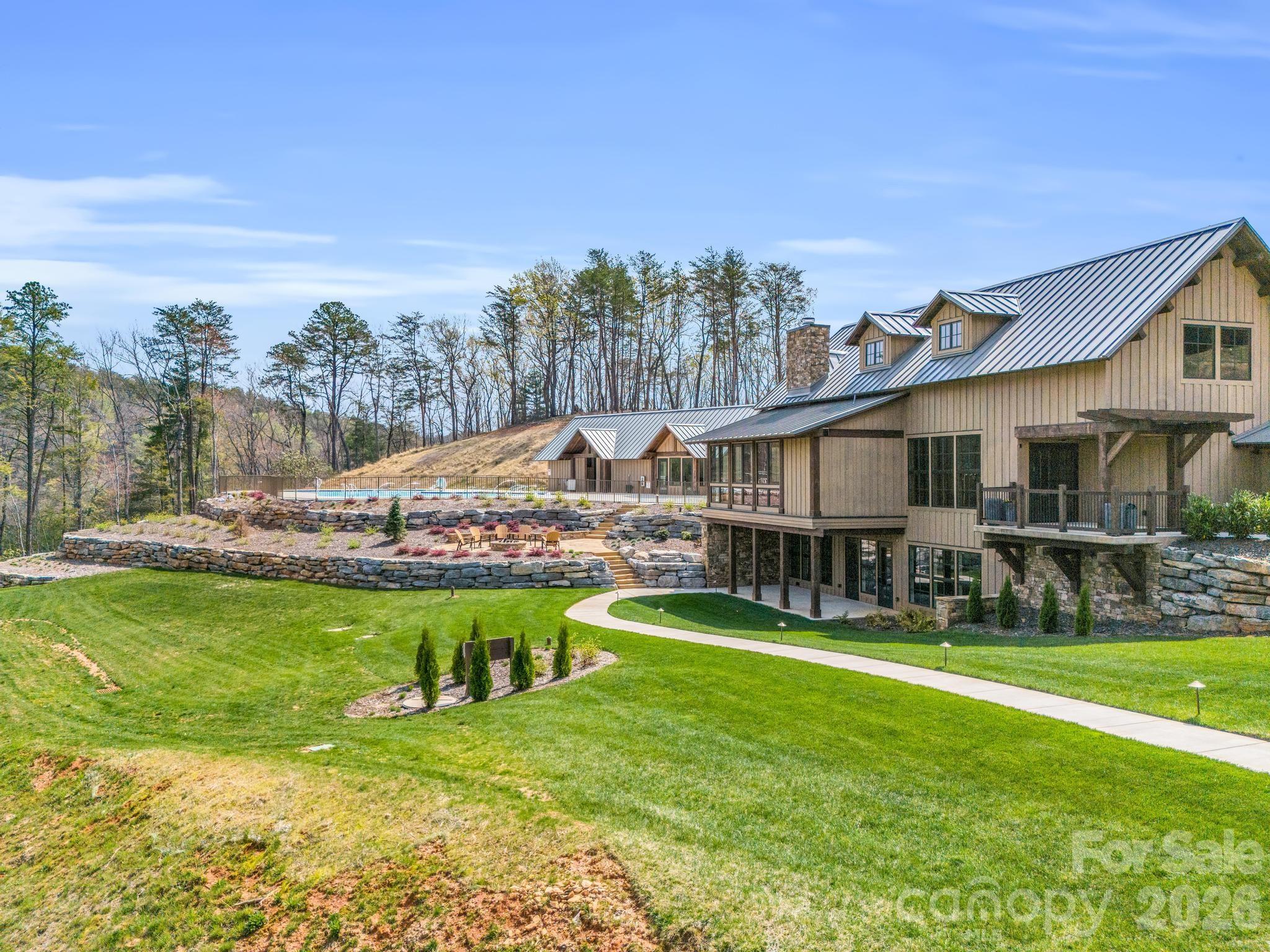0 Deep Gap Farm Road East Mill Spring, NC 28756 - Photo 26 of 39 a view of a house with swimming pool and a yard