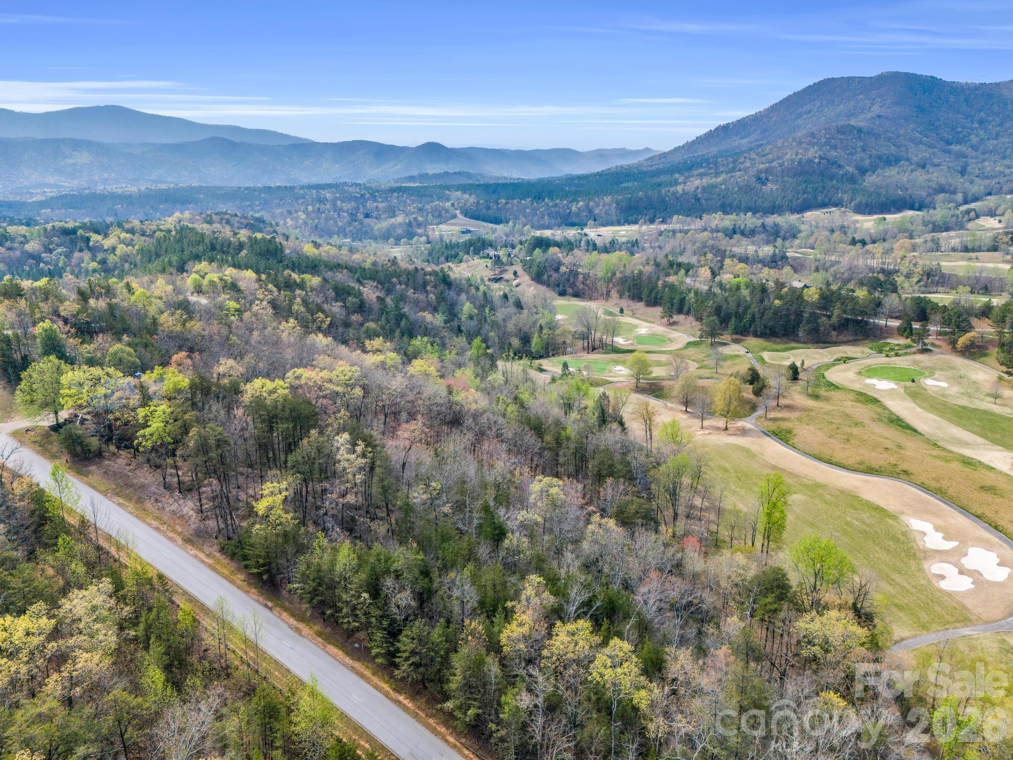0 Deep Gap Farm Road East Mill Spring, NC 28756 - Photo 3 of 39 a view of a city with mountains in the background