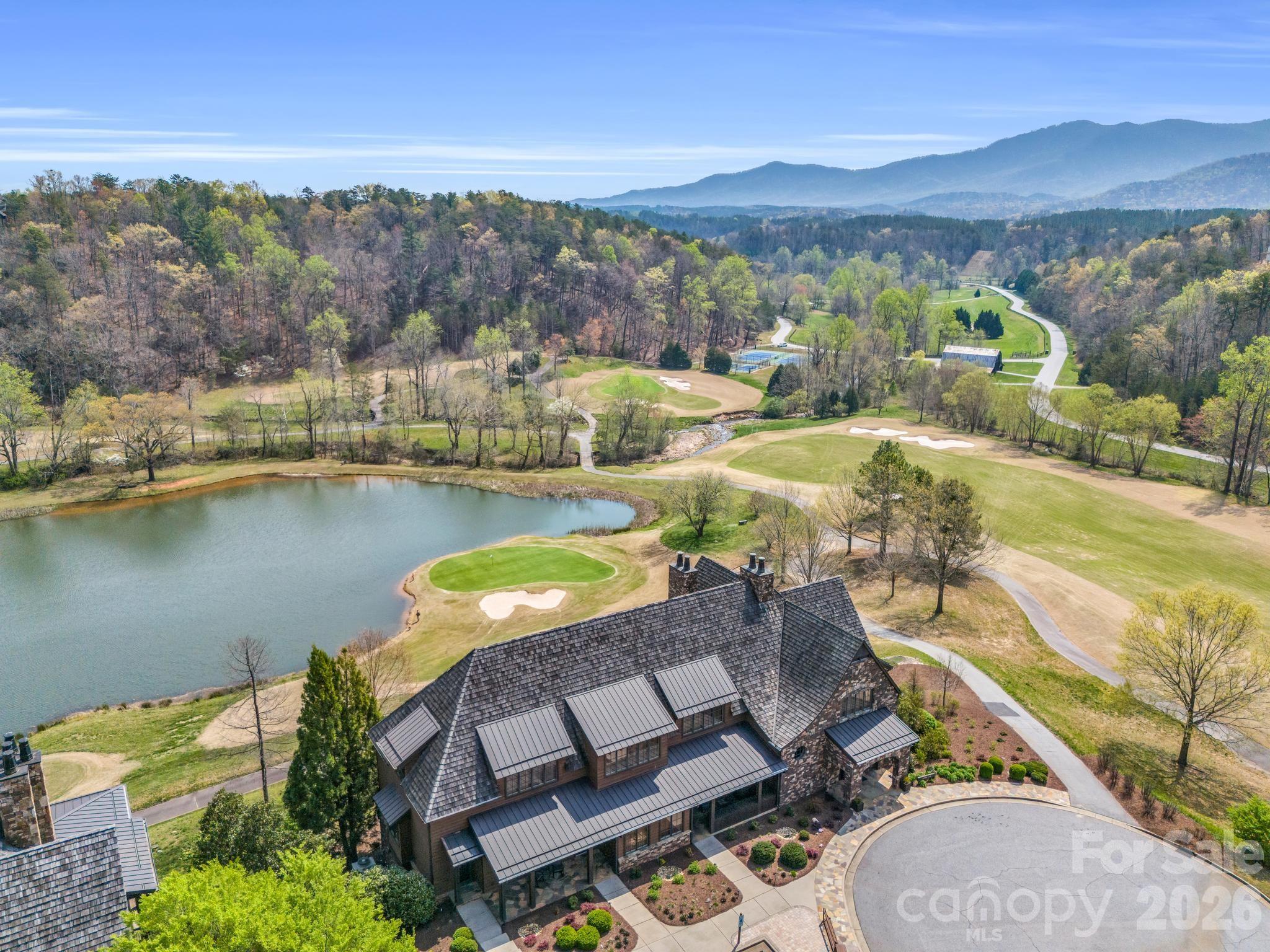 0 Deep Gap Farm Road East Mill Spring, NC 28756 - Photo 32 of 39 an aerial view of residential houses with outdoor space and river
