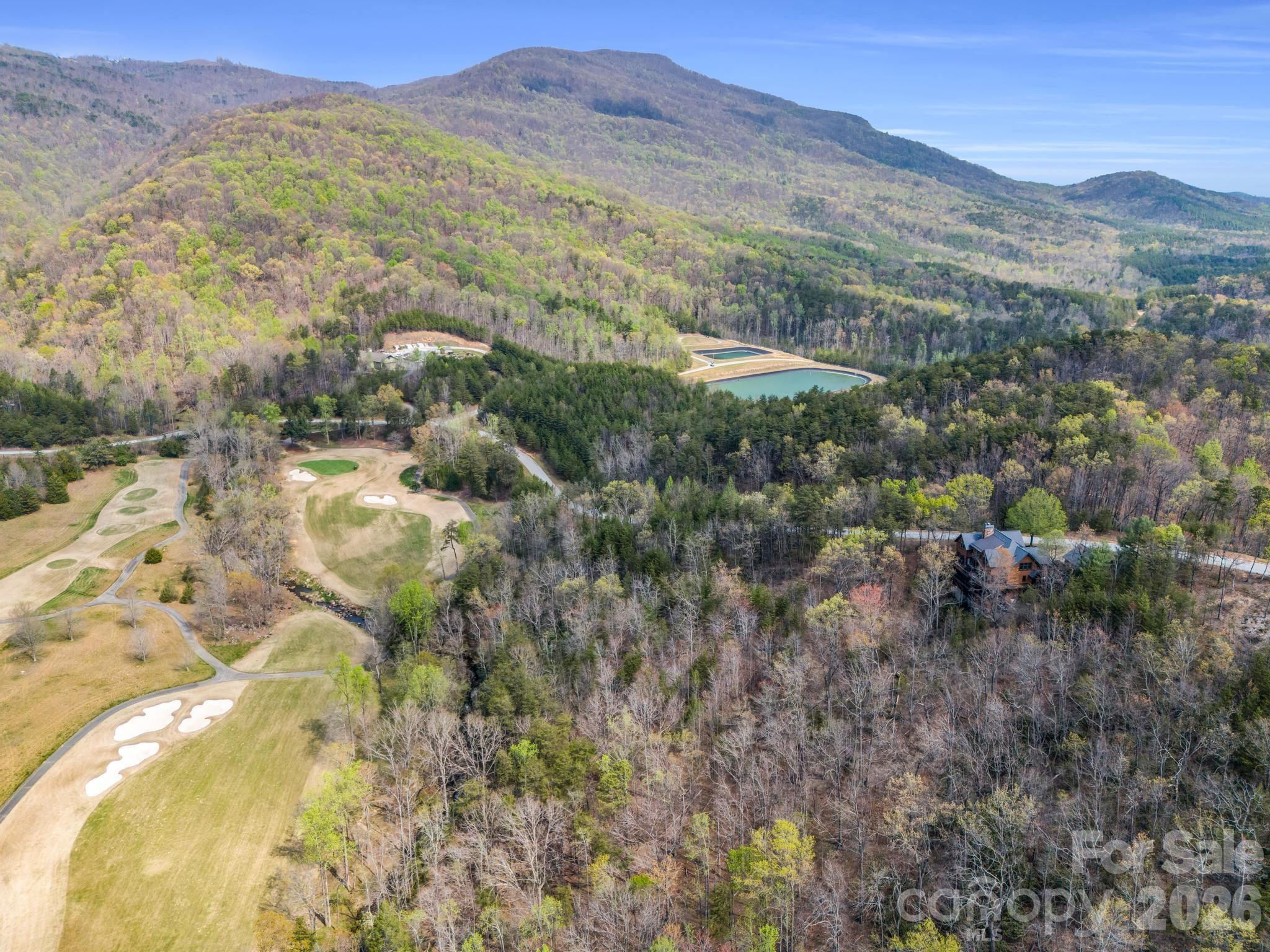 0 Deep Gap Farm Road East Mill Spring, NC 28756 - Photo 10 of 39 a view of a town with mountains in the background
