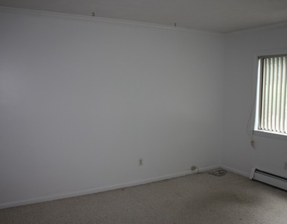 8 Ridge Road, Unit 1 Lincoln, MA 01773 - Photo 7 of 14 an empty room with a window