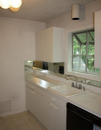 8 Ridge Road, Unit 1 Lincoln, MA 01773 - Photo 8 of 14 a bathroom with a sink and a window