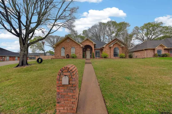 a front view of house with yard and seating