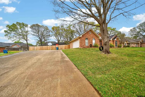 a view of a hallway with entryway wooden floor and chandelier