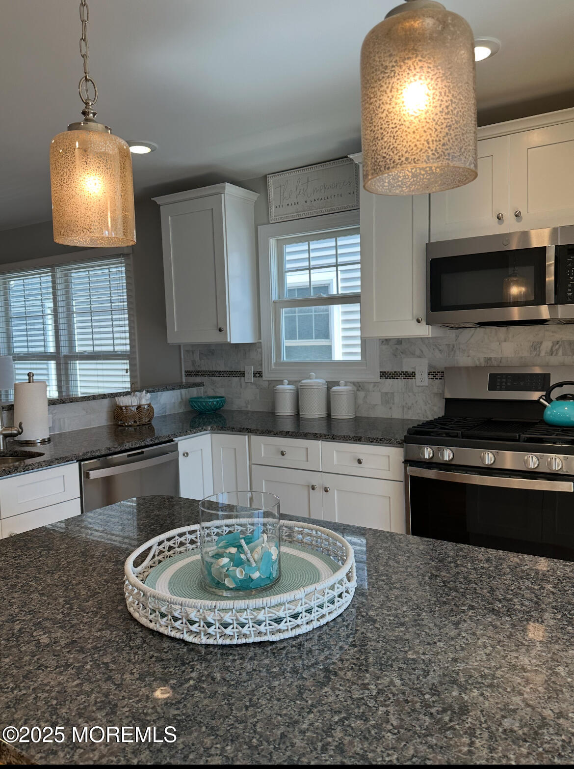 2105 Grand Central Avenue, Unit 1 Lavallette, NJ 08735 - Photo 12 of 33 a kitchen with stainless steel appliances granite countertop a sink a stove a microwave a sink a refrigerator and cabinets