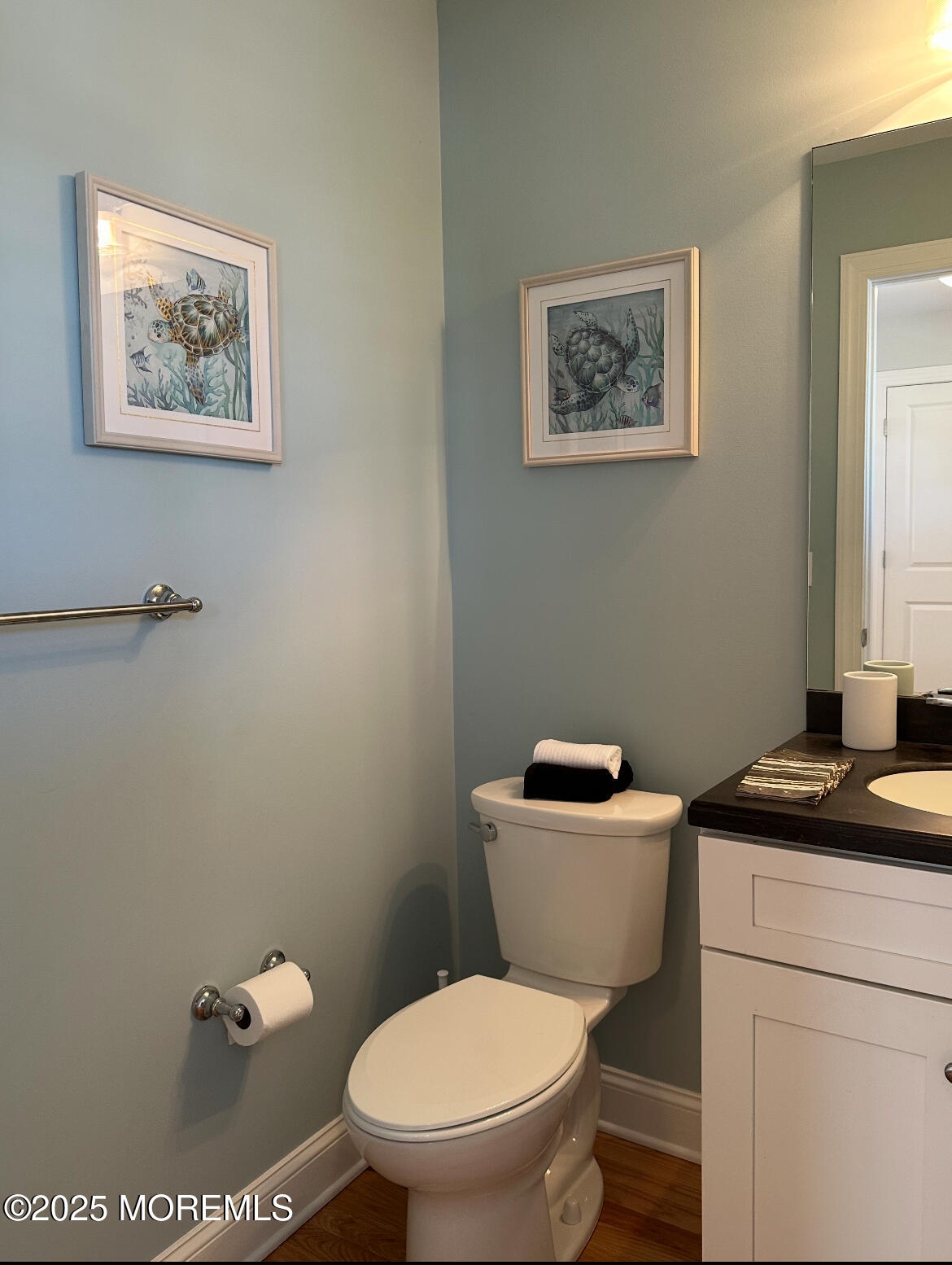 2105 Grand Central Avenue, Unit 1 Lavallette, NJ 08735 - Photo 15 of 33 a bathroom with a toilet a sink and a mirror