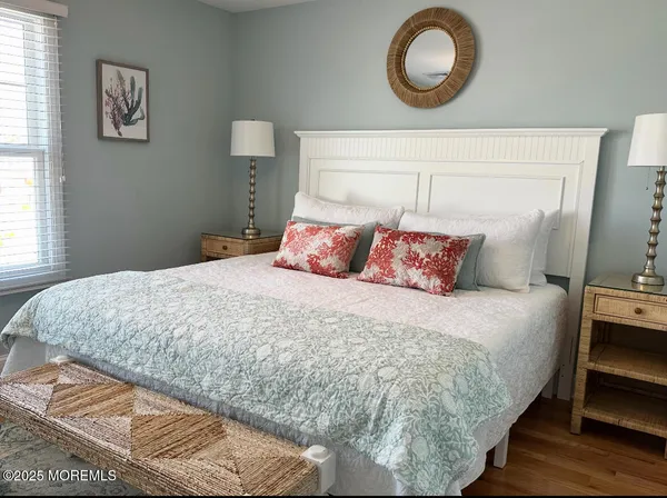 a bedroom with a bed and a lamp