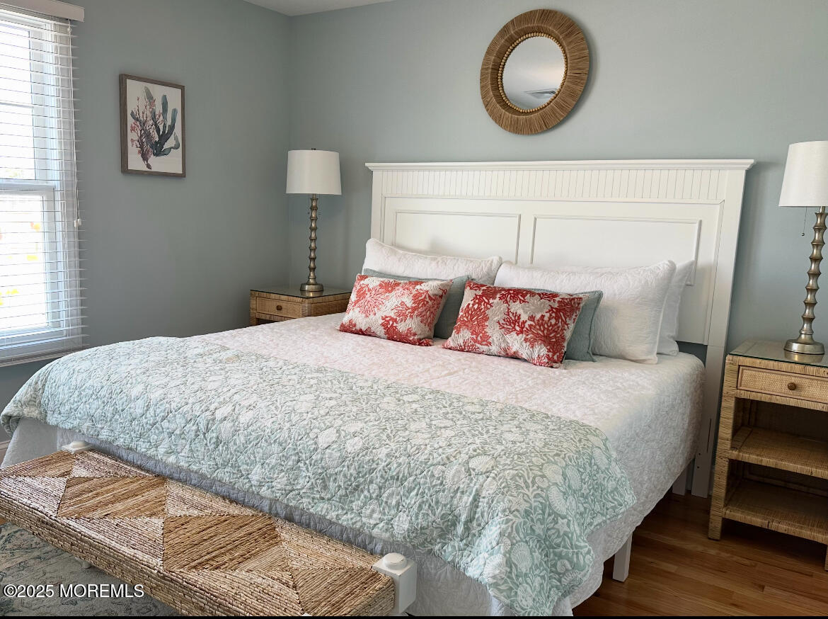 2105 Grand Central Avenue, Unit 1 Lavallette, NJ 08735 - Photo 18 of 33 a bedroom with a bed and a lamp