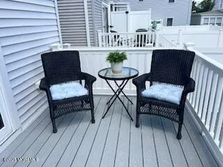 a view of a patio with couple of chairs