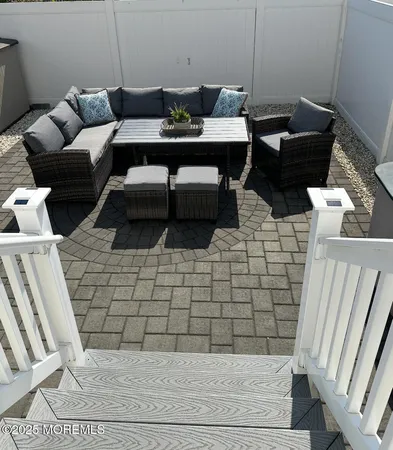 a view of a livingroom with furniture and wooden floor