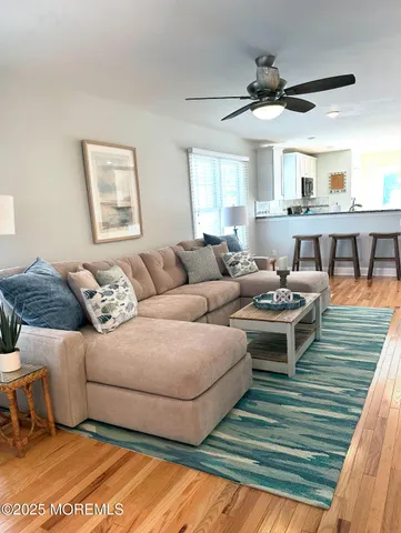 a living room with furniture and a rug