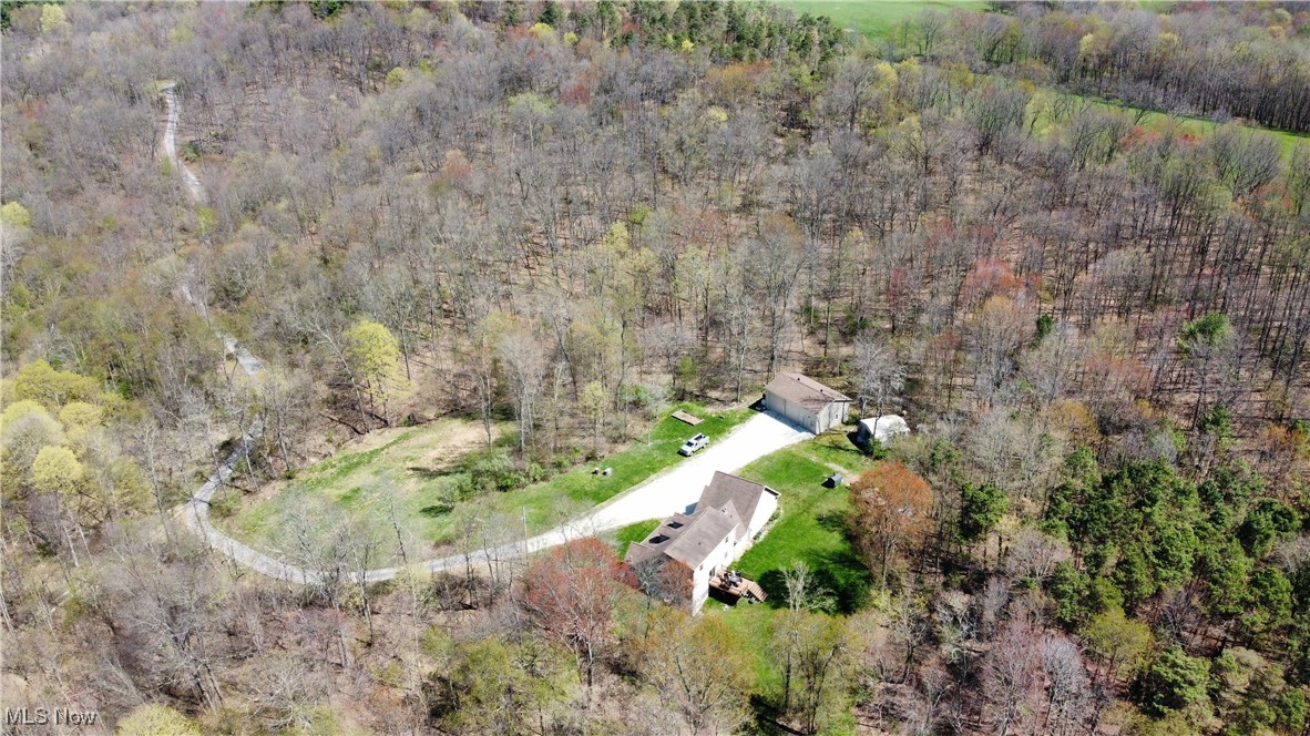 6020 Factor Road Southwest Sherrodsville, OH 44675 - Photo 39 of 39 Bird's eye view with a wooded view