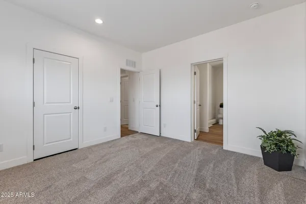 a view of a kitchen with a sink and a refrigerator