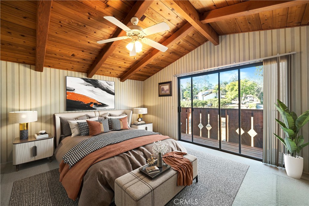 1346 McDonald Road Fallbrook, CA 92028 - Photo 21 of 33 a bedroom with a balcony a bed and a large window with the outer view