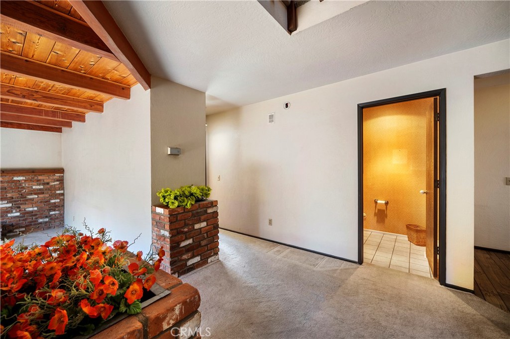 1346 McDonald Road Fallbrook, CA 92028 - Photo 5 of 33 a bedroom with a bed and a painting on the wall