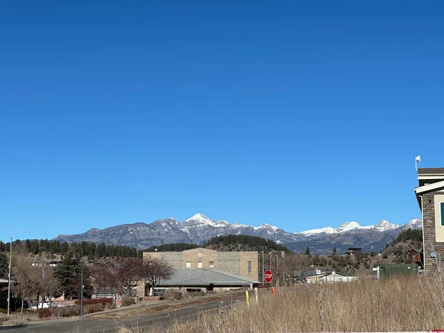 a view of a town with mountains in the background