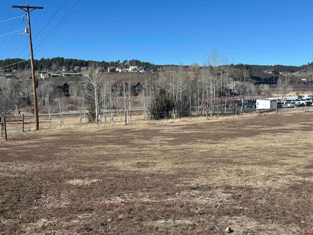 a view of a town with mountains in the background