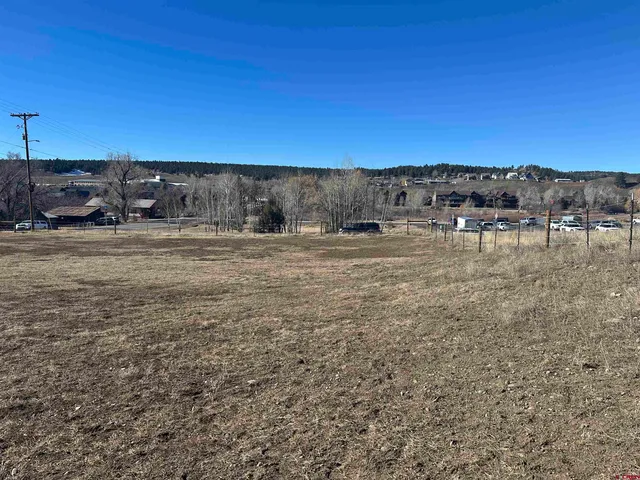 a view of a yard with an ocean view