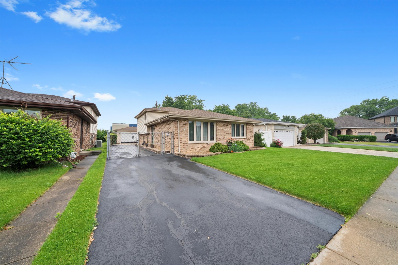 7542 Mason Avenue Burbank, IL 60459 - Photo 1 of 49 a front view of a house with a yard and garage