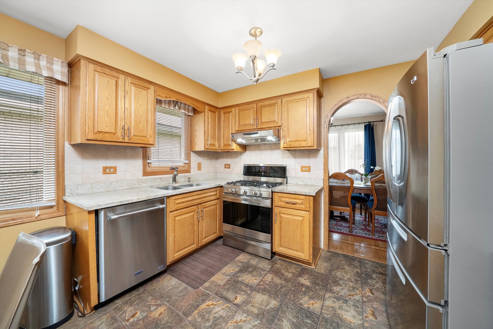 7542 Mason Avenue Burbank, IL 60459 - Photo 12 of 49 a kitchen with a sink stove and cabinets