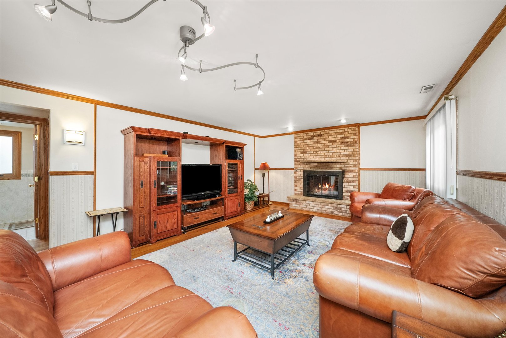 7542 Mason Avenue Burbank, IL 60459 - Photo 16 of 49 a living room with furniture and a flat screen tv