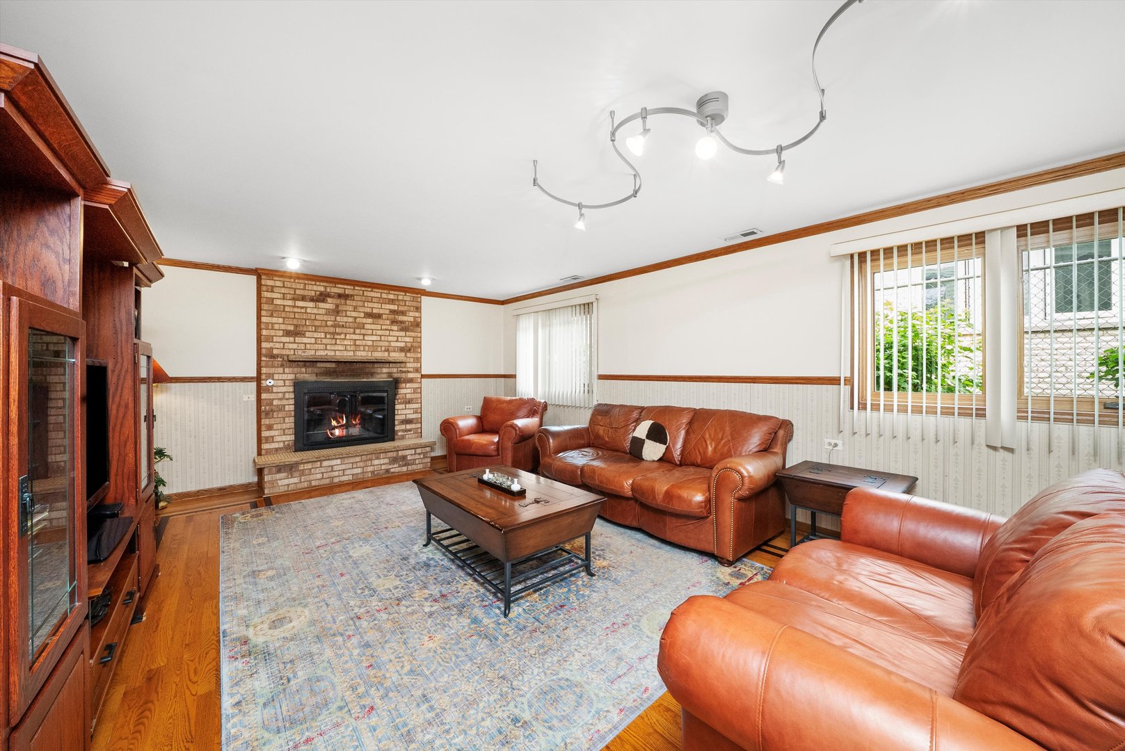 7542 Mason Avenue Burbank, IL 60459 - Photo 17 of 49 a living room with furniture fireplace and a floor to ceiling window