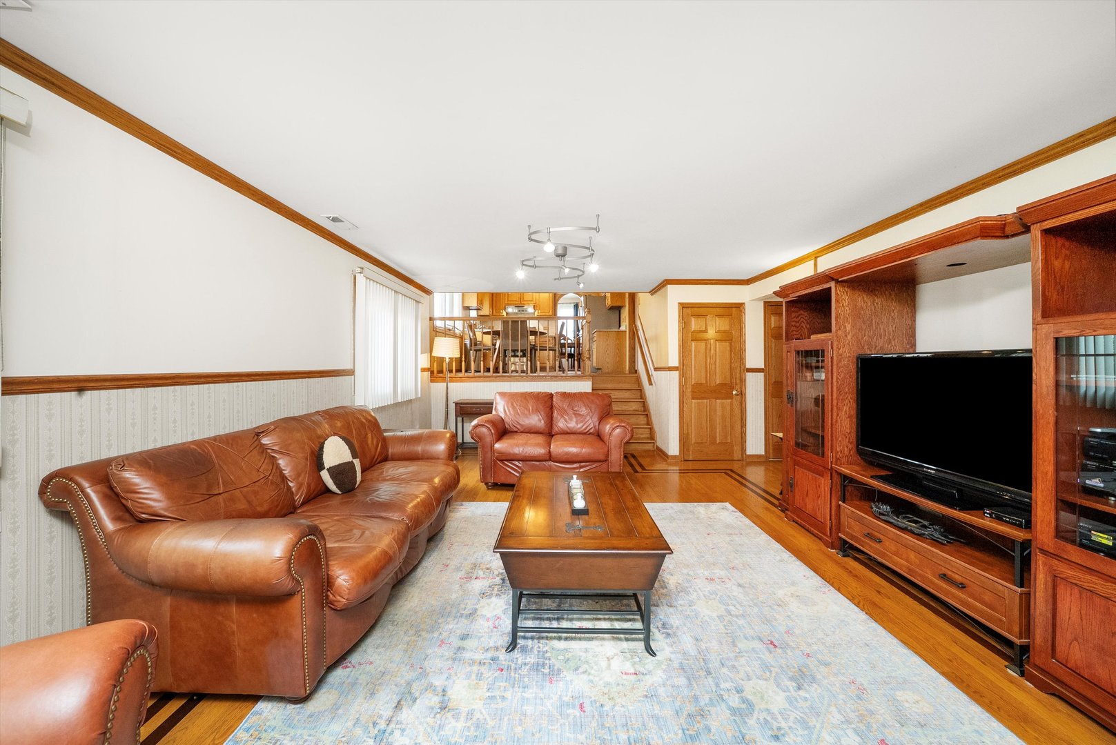 7542 Mason Avenue Burbank, IL 60459 - Photo 19 of 49 a living room with furniture and a flat screen tv