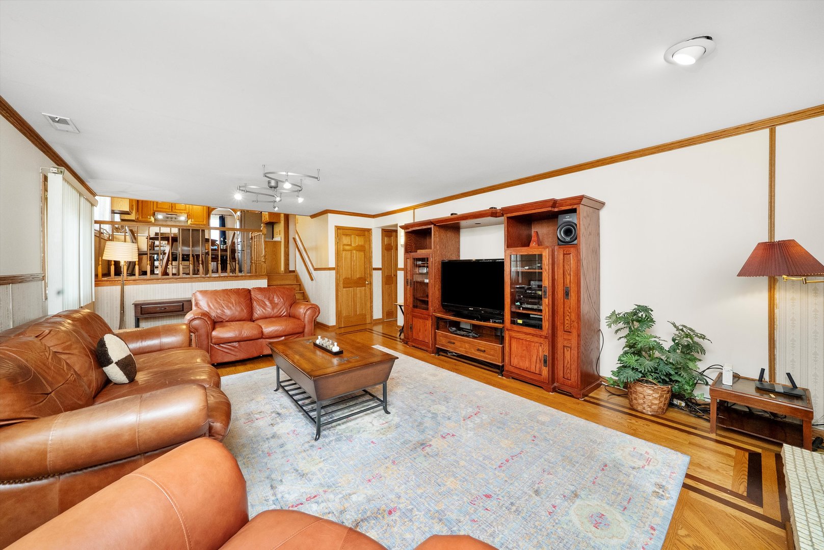 7542 Mason Avenue Burbank, IL 60459 - Photo 20 of 49 a living room with furniture and a flat screen tv
