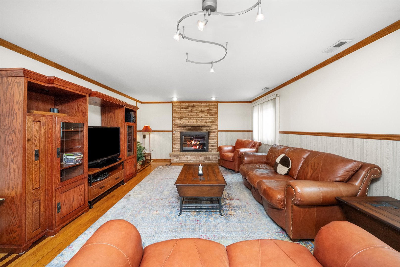 7542 Mason Avenue Burbank, IL 60459 - Photo 21 of 49 a living room with furniture flat screen tv and wooden floor