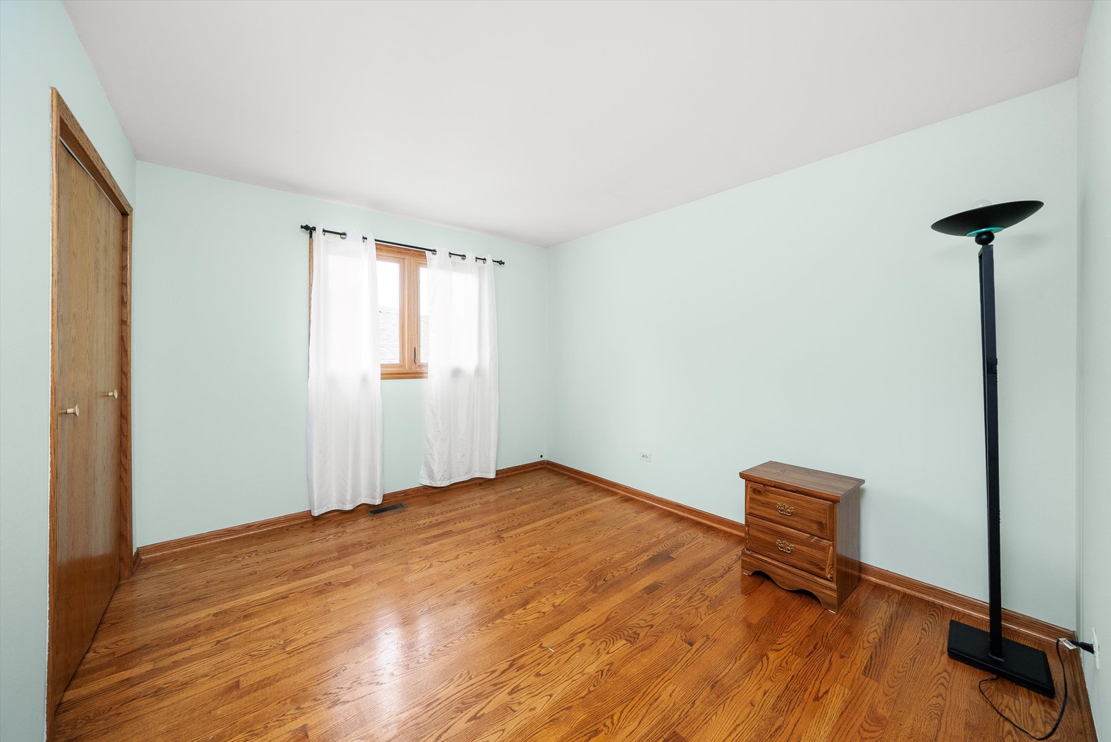 7542 Mason Avenue Burbank, IL 60459 - Photo 22 of 49 a view of a room with wooden floor and a window