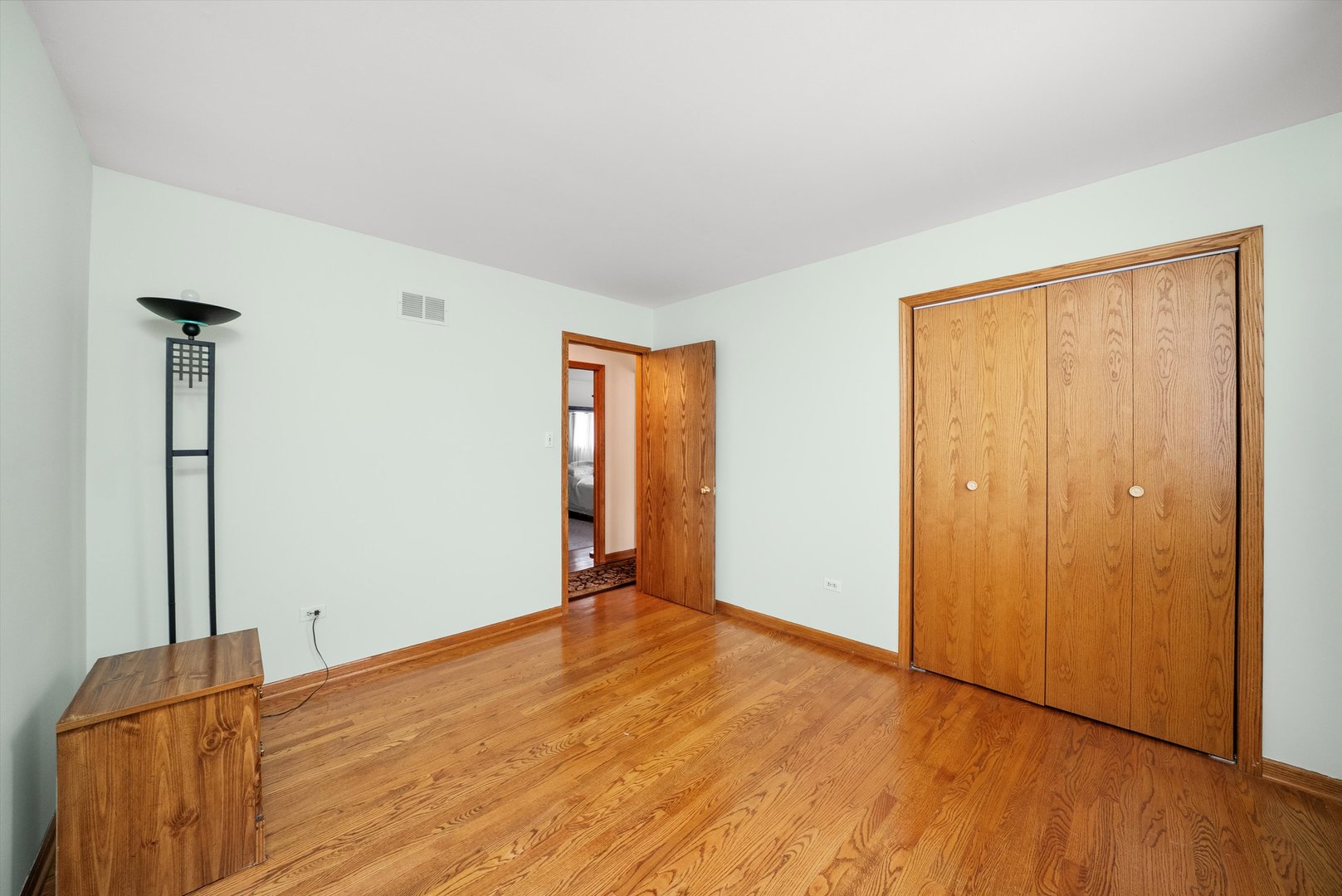 7542 Mason Avenue Burbank, IL 60459 - Photo 24 of 49 a view of empty room with wooden floor