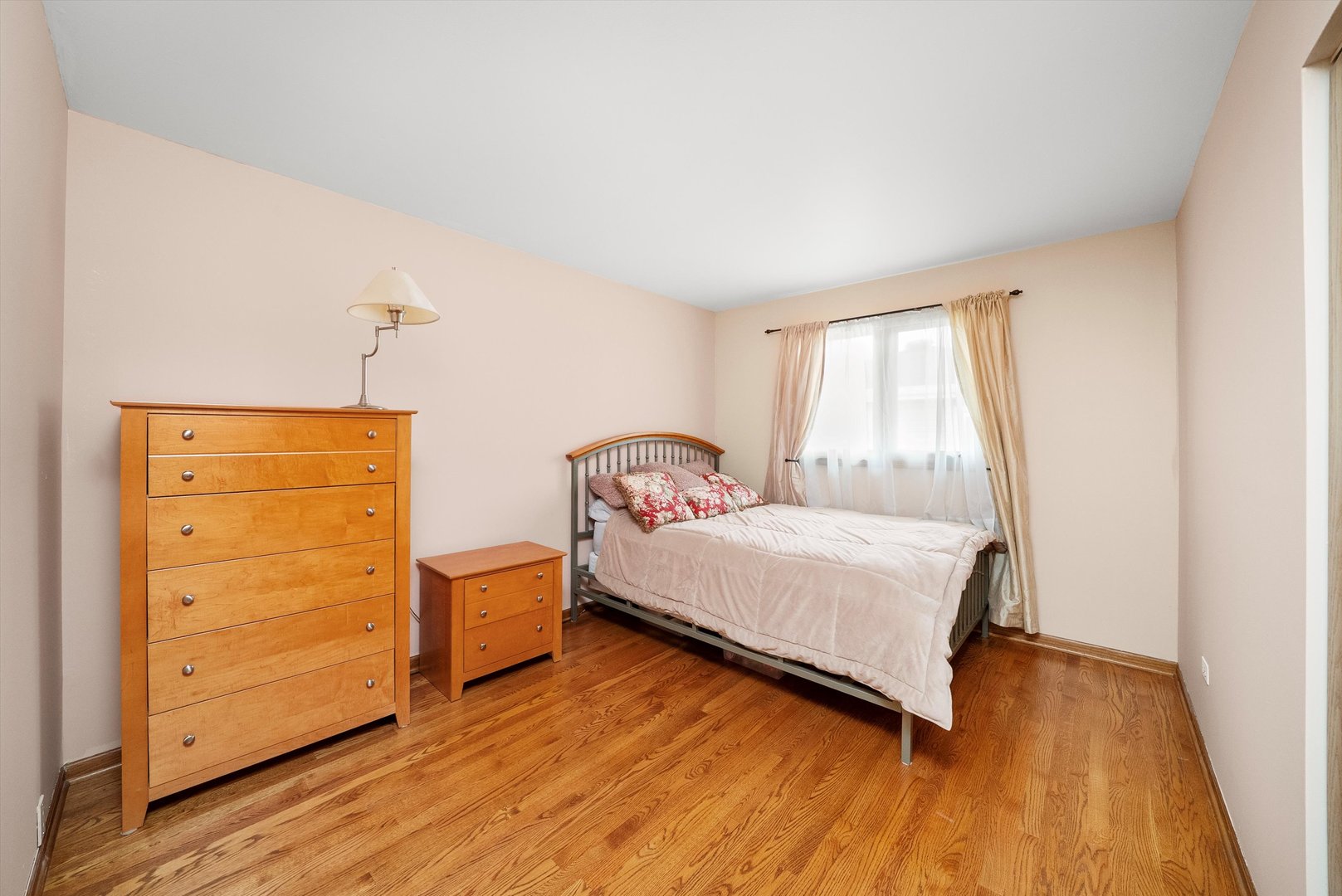 7542 Mason Avenue Burbank, IL 60459 - Photo 27 of 49 a bedroom with a bed and wooden floor