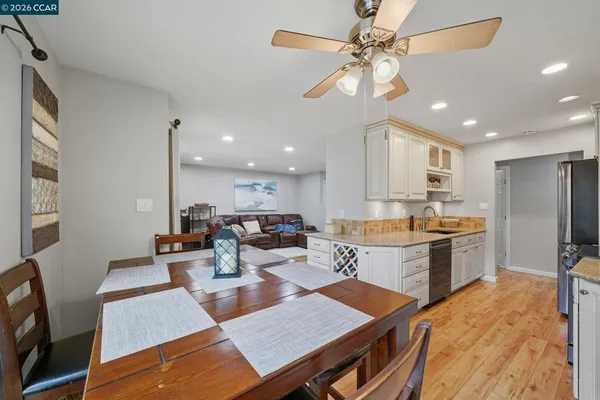 a view of a dining room with a table and chairs