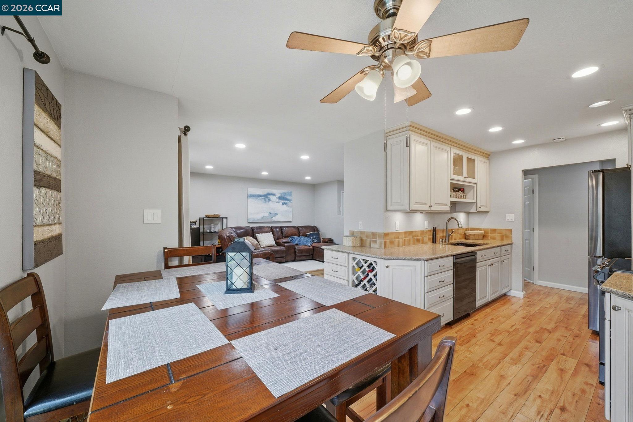 9025 Alcosta Boulevard, Unit 259 San Ramon, CA 94583 - Photo 11 of 40 a large kitchen with a table and chairs