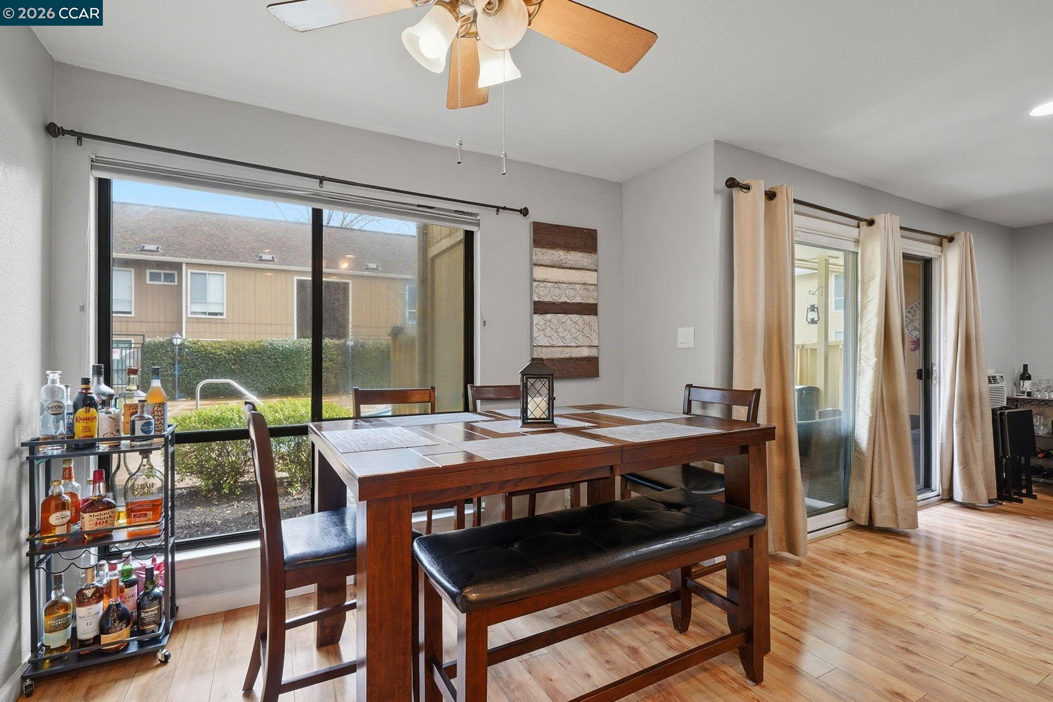 9025 Alcosta Boulevard, Unit 259 San Ramon, CA 94583 - Photo 13 of 40 a view of a dining room with furniture window and wooden floor