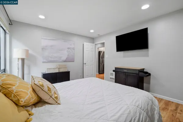 a bedroom with a bed and a fireplace