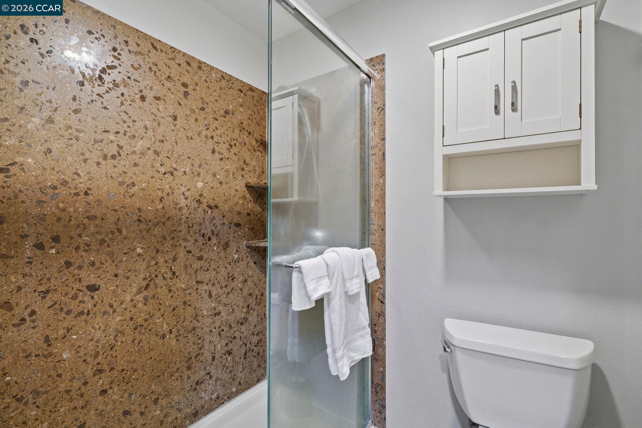 9025 Alcosta Boulevard, Unit 259 San Ramon, CA 94583 - Photo 23 of 40 a bathroom with a toilet and shower