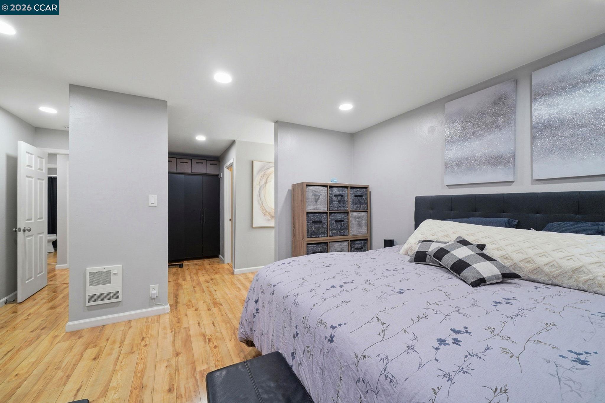 9025 Alcosta Boulevard, Unit 259 San Ramon, CA 94583 - Photo 27 of 40 a bedroom with a large bed and wooden floor