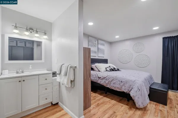 a living room with furniture and white walls