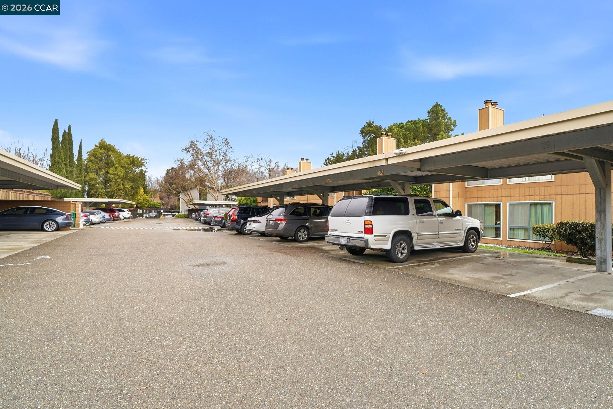 9025 Alcosta Boulevard, Unit 259 San Ramon, CA 94583 - Photo 31 of 40 a view of a cars parked in front of a building