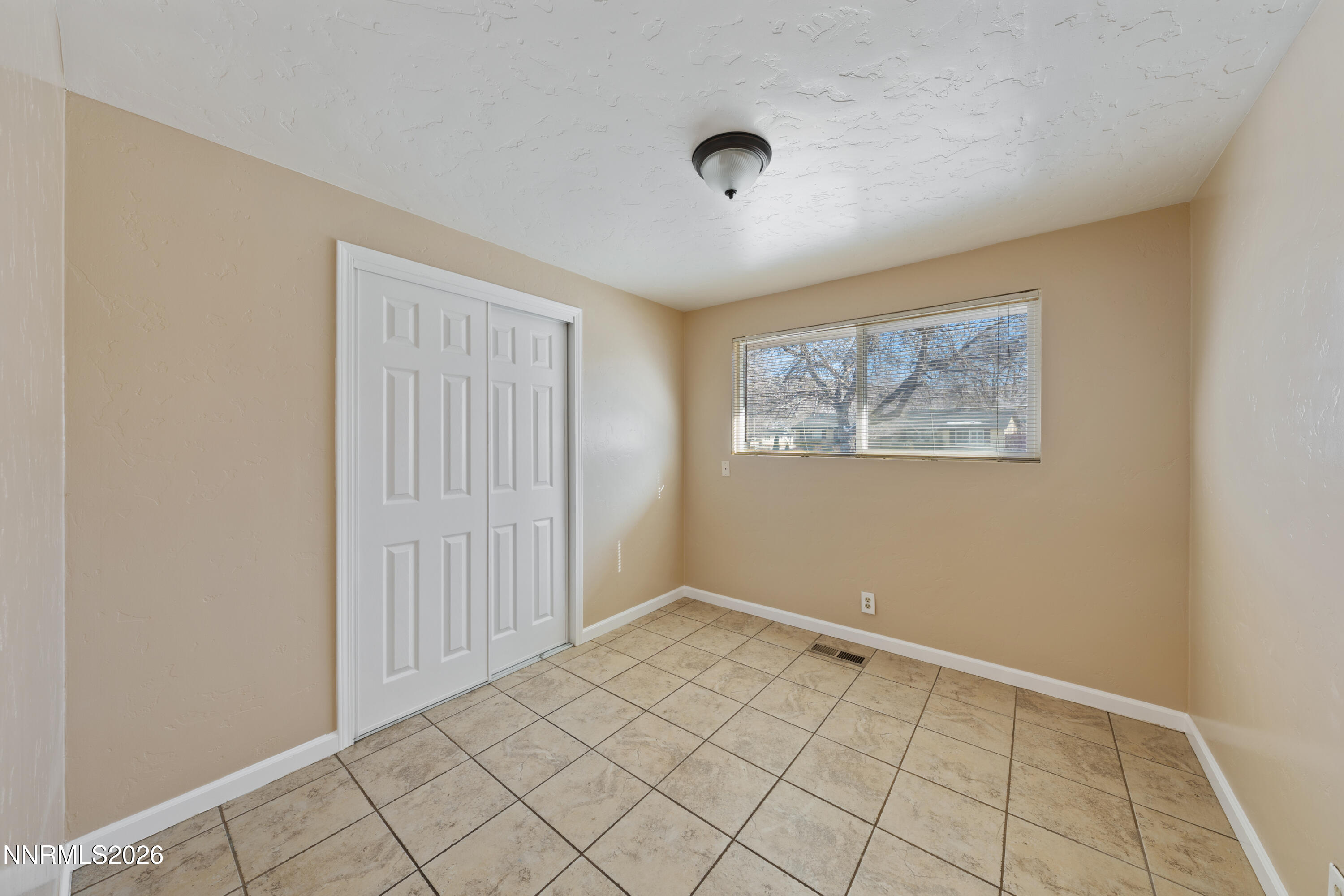 9035 Fremont Way Reno, NV 89506 - Photo 21 of 44 an empty room with windows