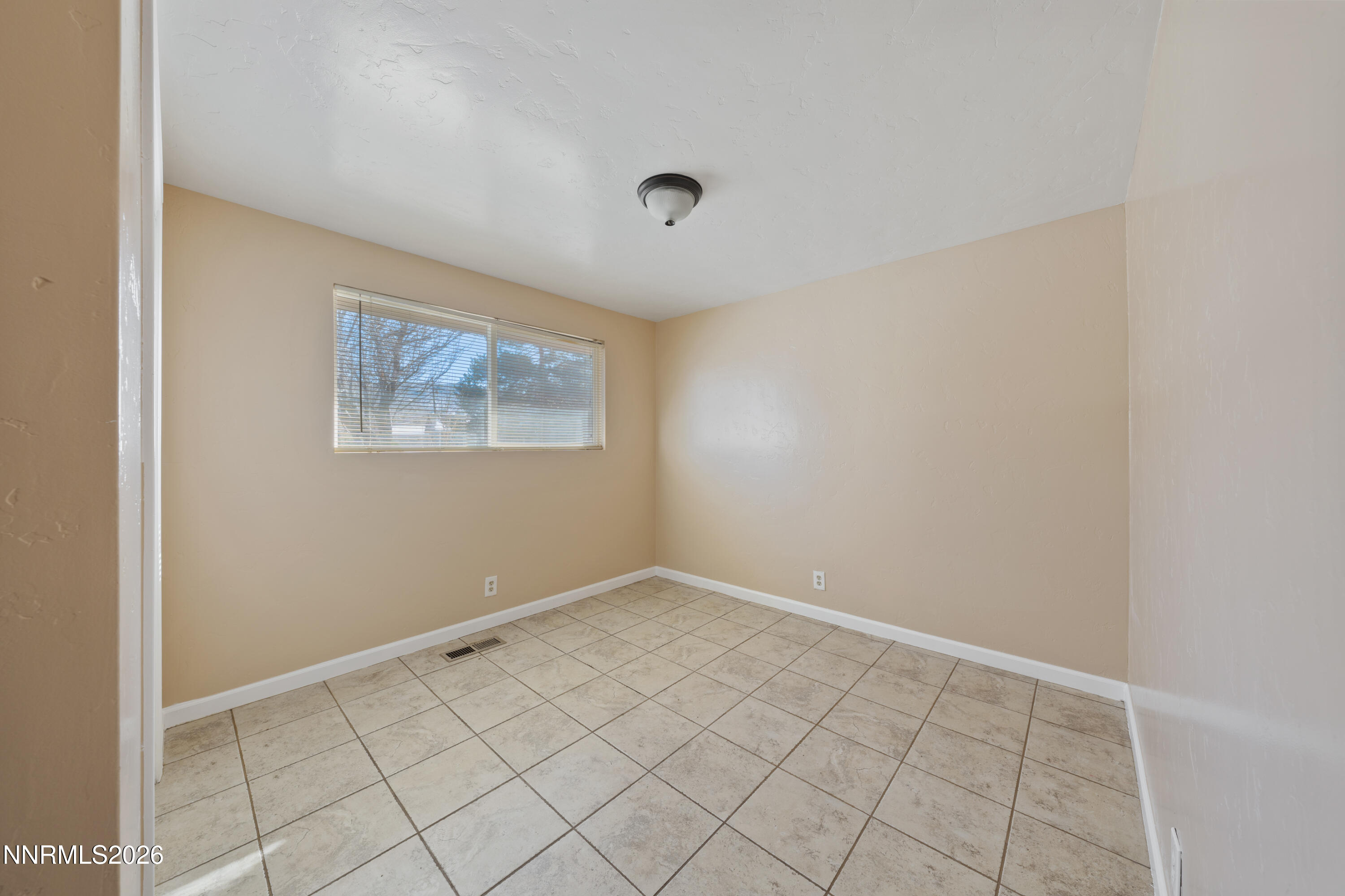 9035 Fremont Way Reno, NV 89506 - Photo 25 of 44 a view of an empty room with window