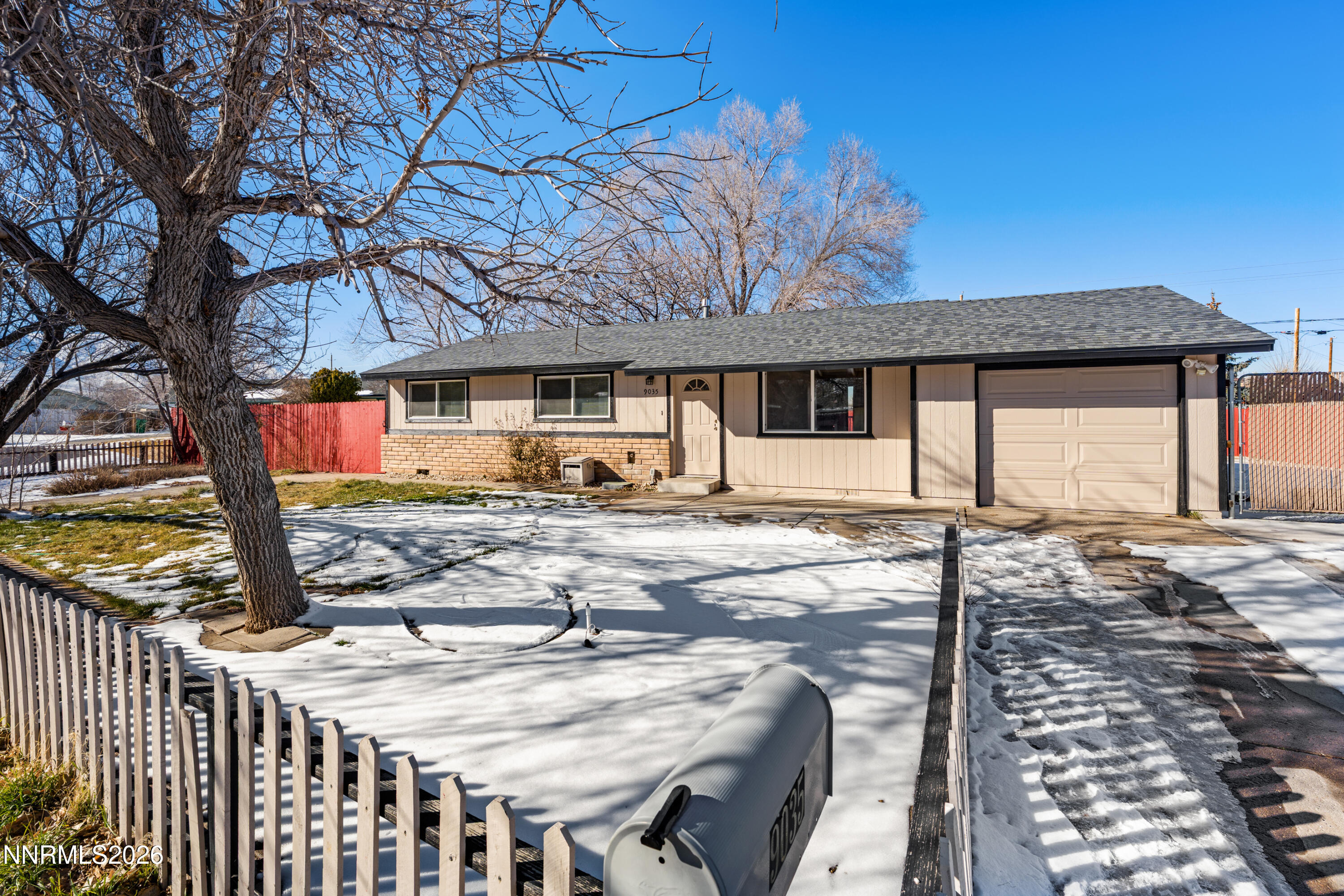 9035 Fremont Way Reno, NV 89506 - Photo 3 of 44 a view of a yard with wooden fence