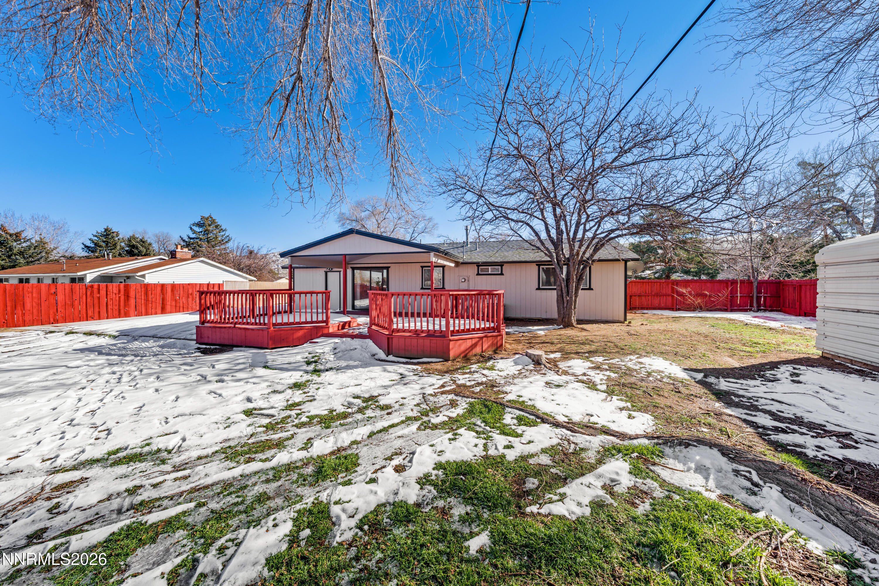 9035 Fremont Way Reno, NV 89506 - Photo 5 of 44 a front view of a house with a yard