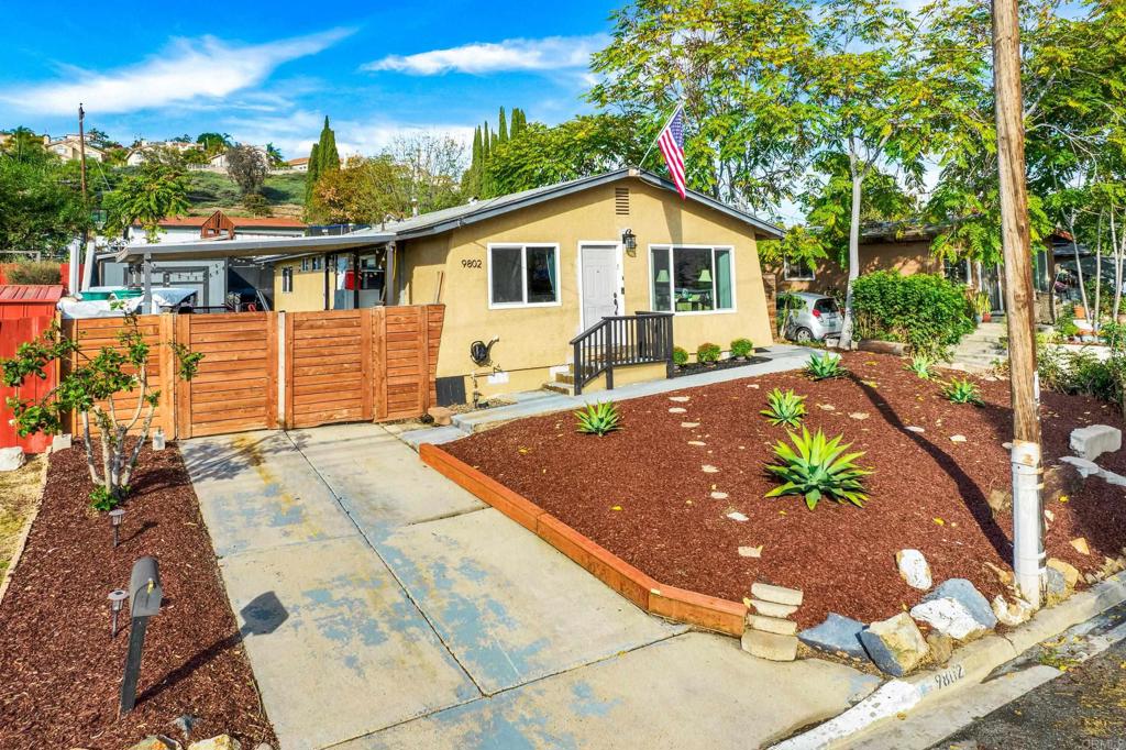 9802 St George Street Spring Valley, CA 91977 - Photo 1 of 1 a view of a house with backyard and sitting area