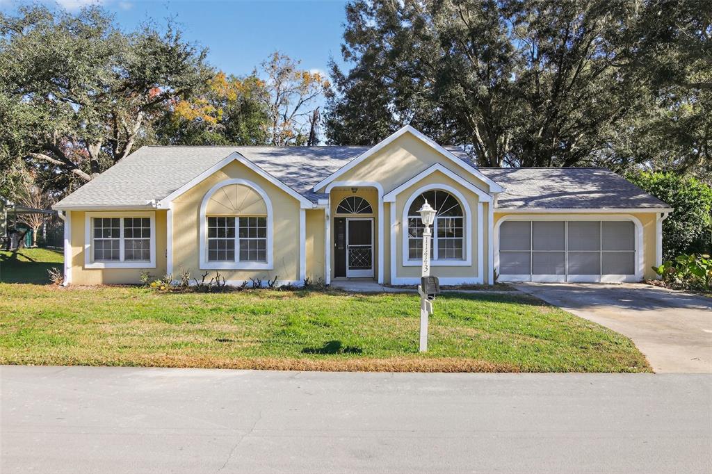 a view of a yard in front view of a house